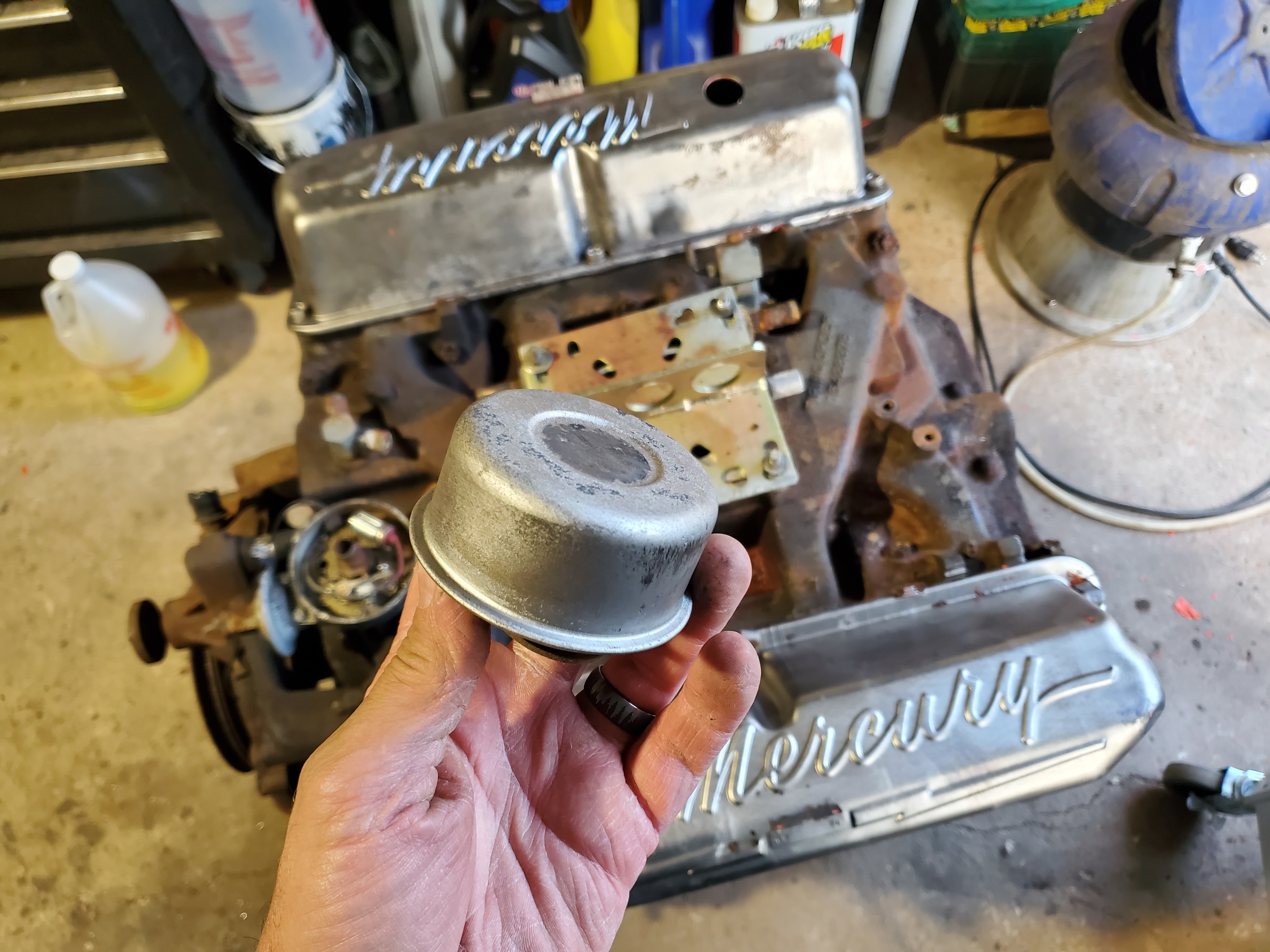 Laser paint removal on assembled engine breather top.